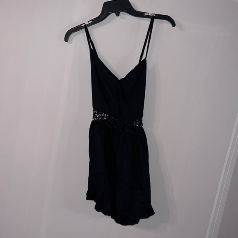 Hollister size small black romper with floral cut out and midsection